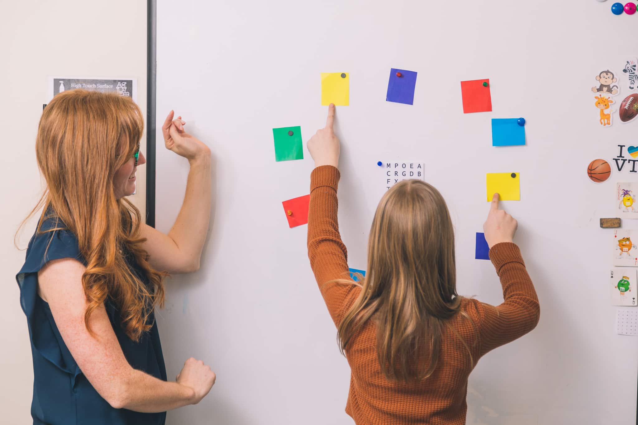 A young girl doing vision therapy at Aurora Eye Care.