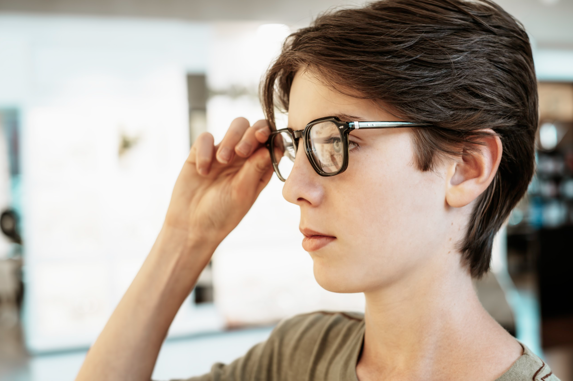 Child wearing new glasses from Aurora Eye Care's Back-to-School Sale