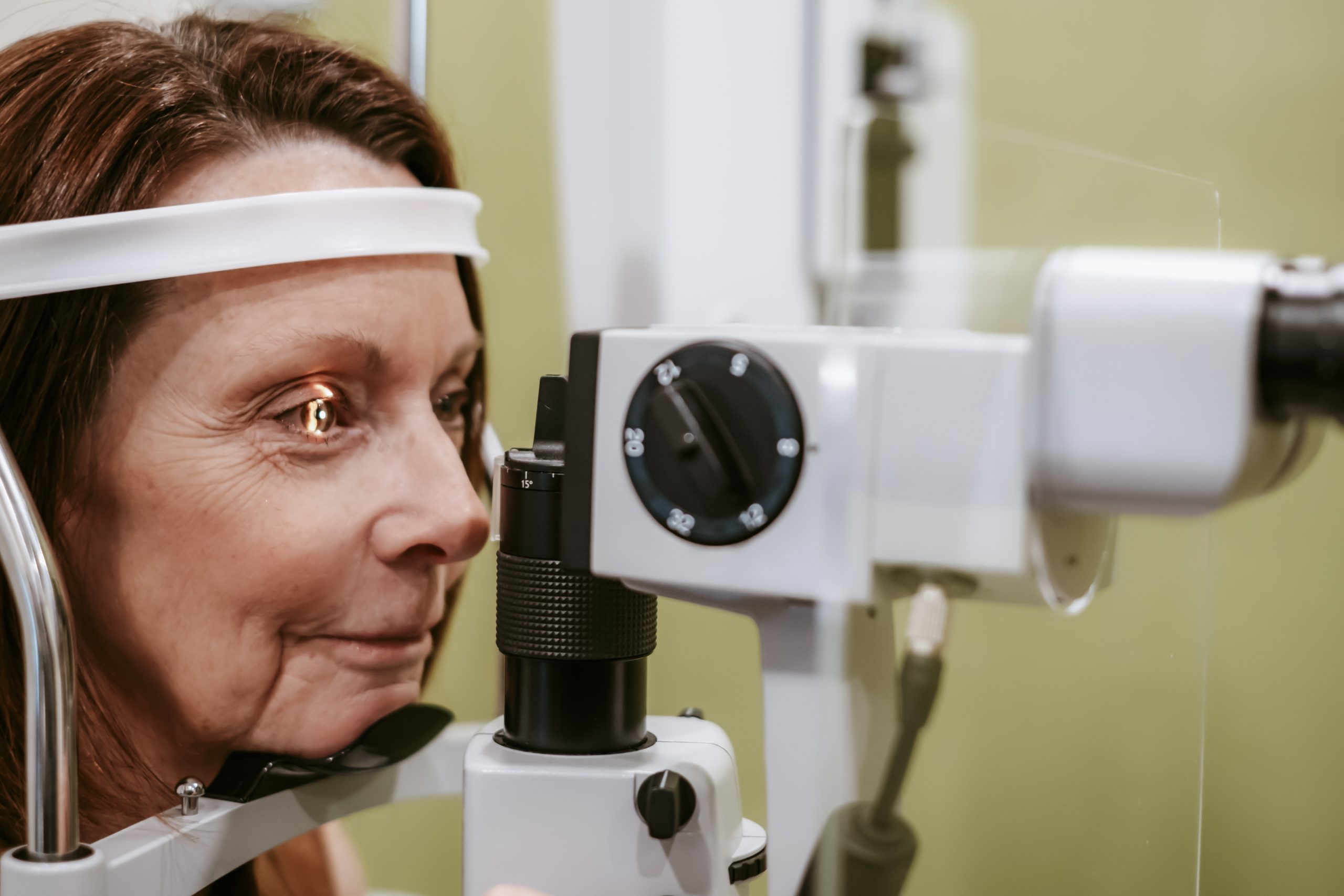 Person having an astigmatism eye exam at Aurora Eye Care in Grande Prairie